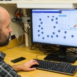 A man managing Customer Data Management System.