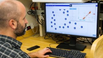 A man managing Customer Data Management System.