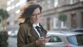 A woman looking into the mobile.