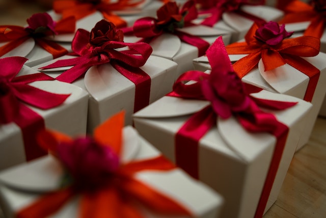 Beautiful gift boxes with red ribbons.
