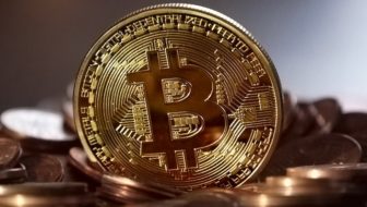 A golden bitcoin with B embossed in it.