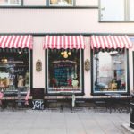 A food stores with glass windows.