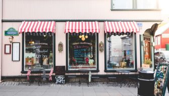 A food stores with glass windows.