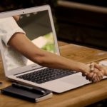A man shaking hands for Online Business.