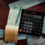 An invoice book and a calculator.