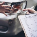 A woman hplding car documents.