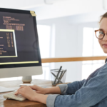 Woman working on a computer.