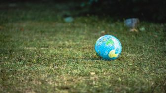 A small globe on the grass.