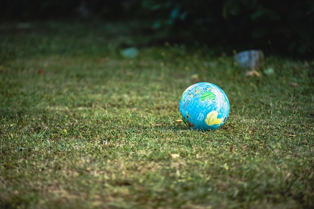 A small globe on the grass.