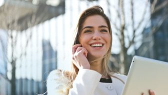 A woman talking over the phone.