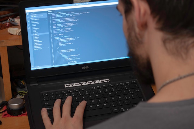 A man performing coding.