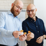 Two men with cryptocurrencies.