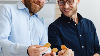 Two men with cryptocurrencies.