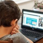 A boy learning online.