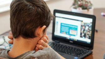 A boy learning online.