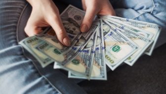 A man holding money.