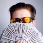Man holding money in his hand.