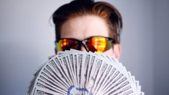 Man holding money in his hand.