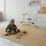baby playing on rug