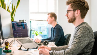 A team in an office researching digital customer service during a meeting