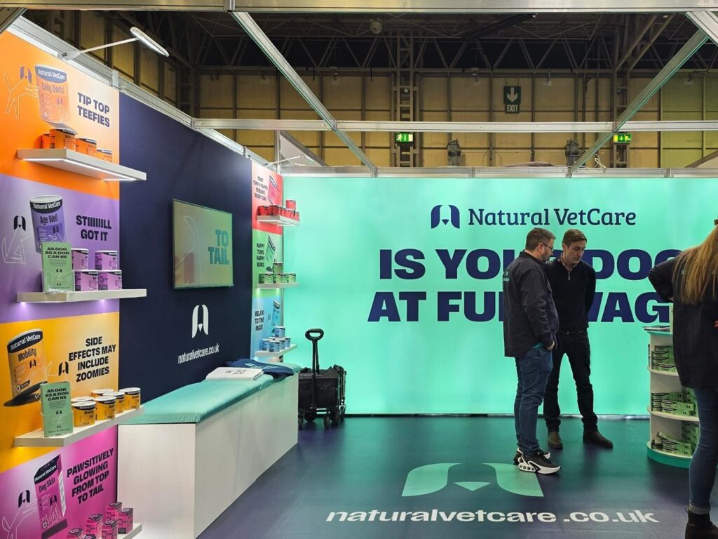 A group of men standing in a room with a sign
AI-generated content may be incorrect.
